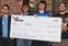 
						From left, students Jeremy Poulin, Nick Ver Voort, Michael Stowell and Justin Mayhew receive a check for $3,000 for their winning nutrition-training Android app. Photo by Alexandra Foran
					