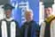 From left, head coach Gary Gardner, senior Donte Brown, Chancellor Marty Meehan, senior Angus MacDonald.