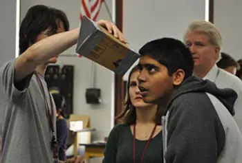 Vibes and Waves Fellow Molly Clay, center, conducts diffraction experiments in a physics class at Lowell High School.