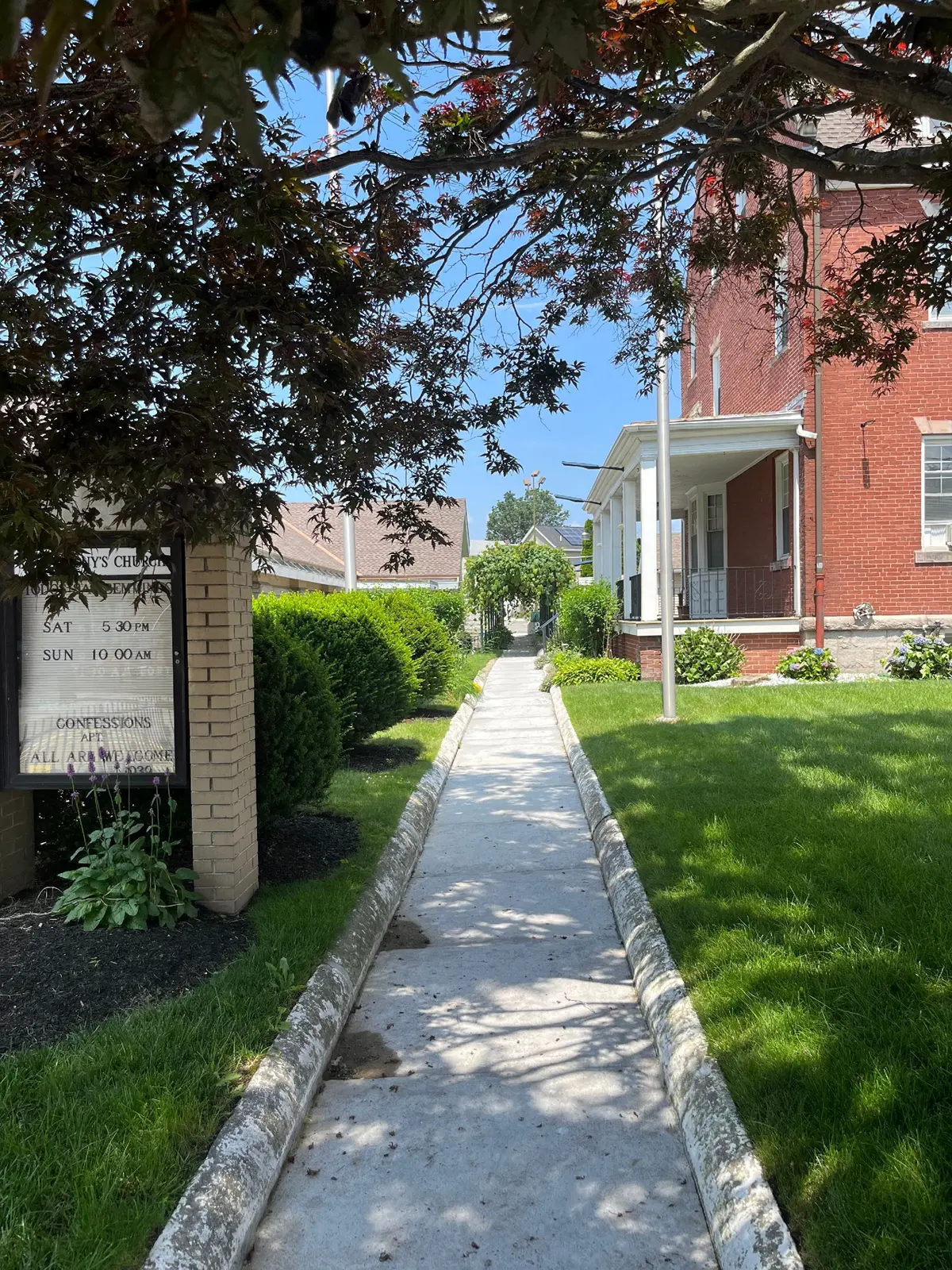 The arbor walk along the side of St. Anthony’s rectory in Lowell.