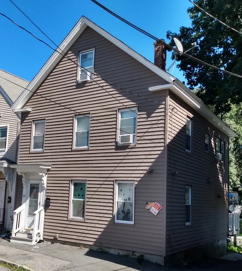 Home exterior Vernacular with Greek Revival elements with off-center entrance.