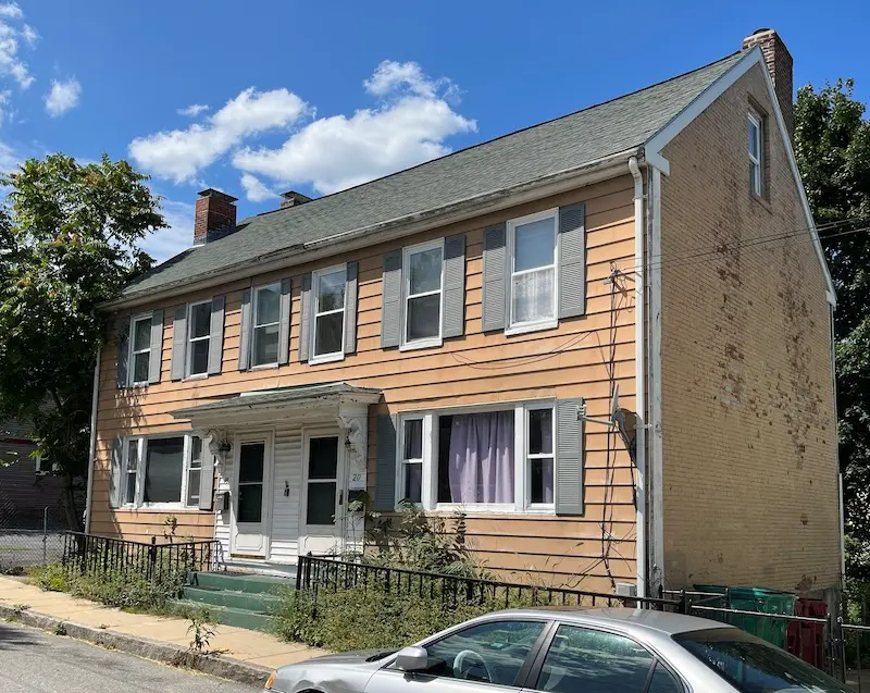 Two-family duplex with Federal style elements.