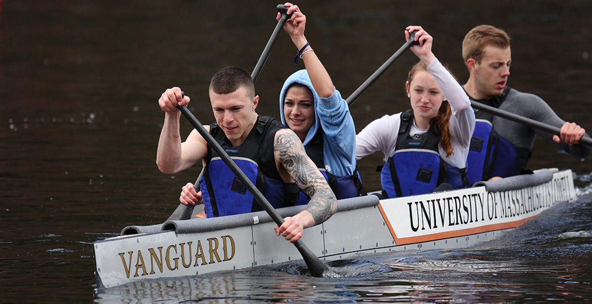  Timothy Roberts, Natalie Melconian, Rebecca Gonsalves-Lamontagne, and Zachary Morris paddle UMass Lowell's concrete canoe during the 2014 regional competition.