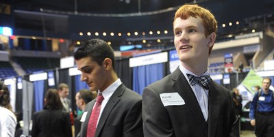 Two male students at the Career & Co-op Center's Career Fair at the Tsongas Center.