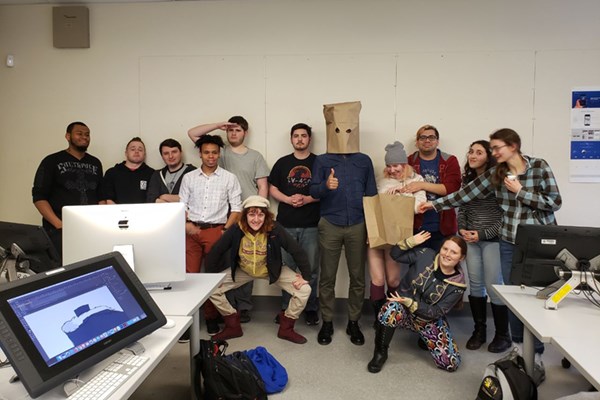 A whimsical shot of the Class of 2020 of UML’s animation program. That's Pouya Afshar in the bag.