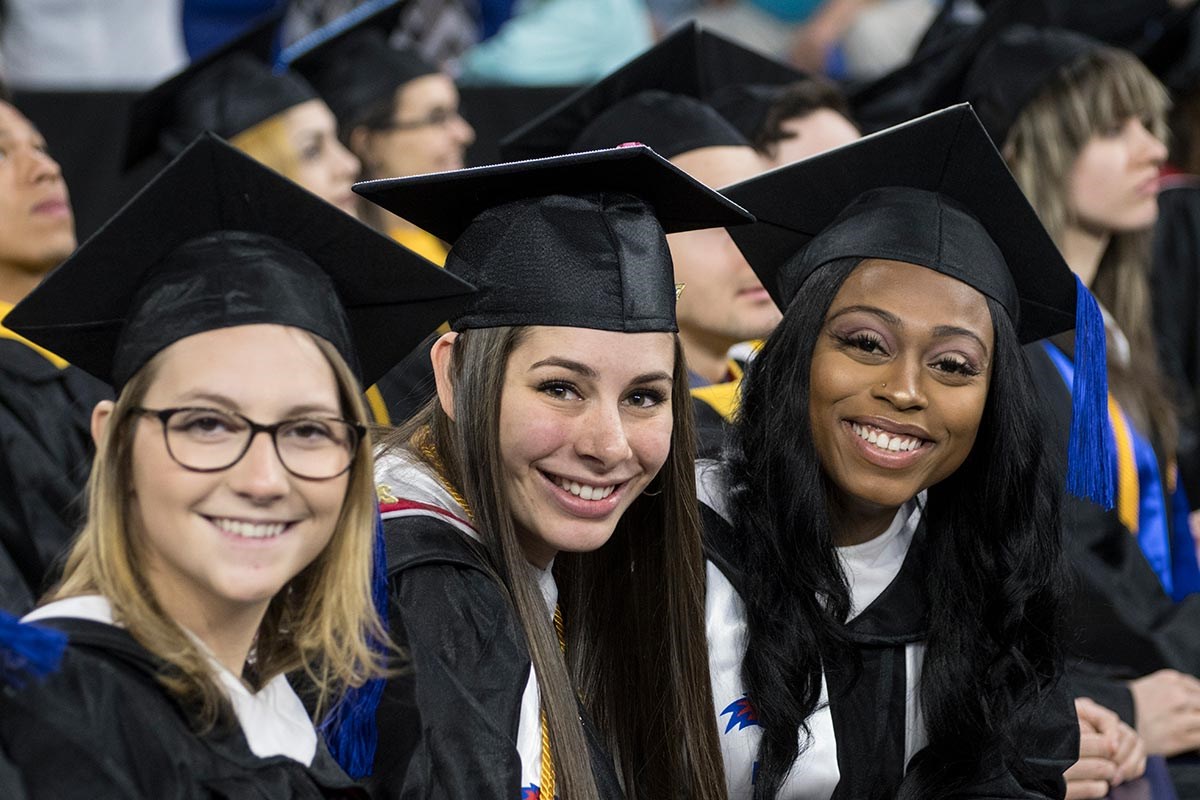 Three women at morning commencement ceremony