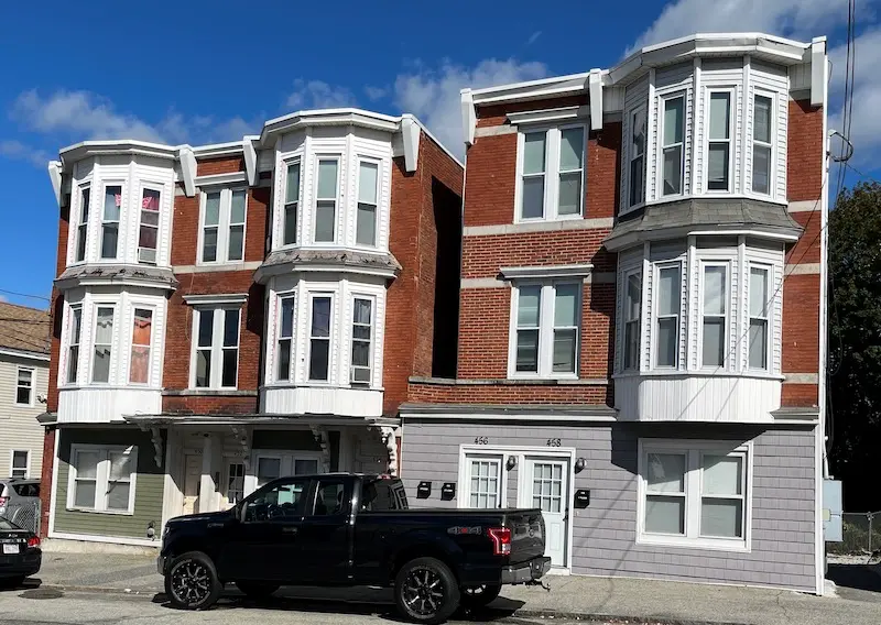 Three story Italianate structure built mostly of brick with wood frame.