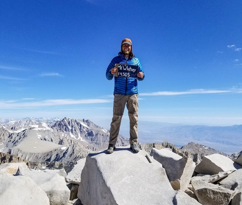 Kyle Soeltz stands atop Mt. Whitney on the Pacific Crest Trail