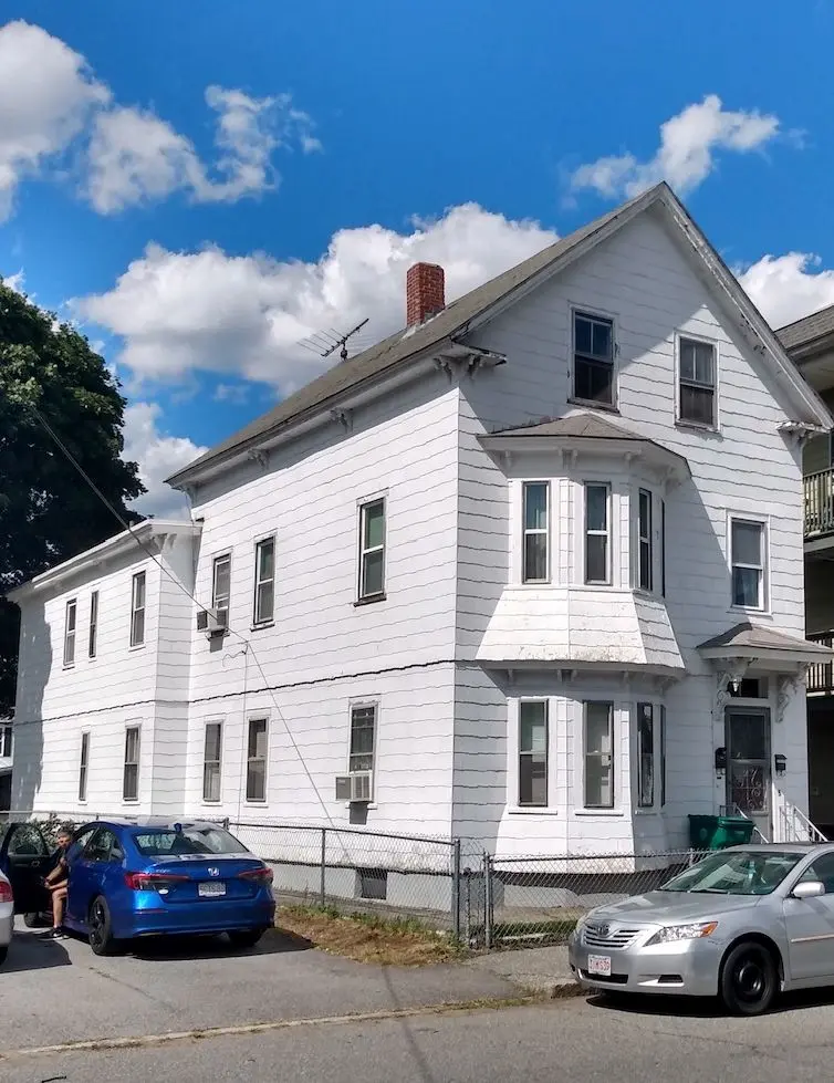Italianate two-story two-family residence. 