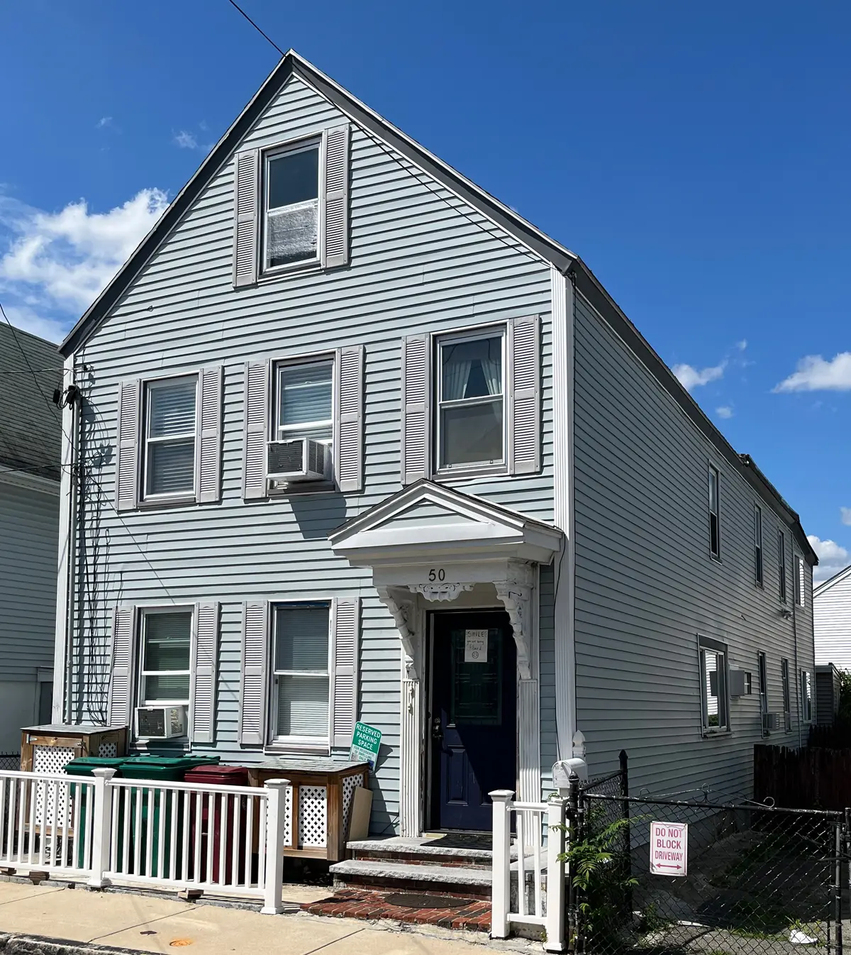 Picture of 50 North Street, light gray, two story house with attic.