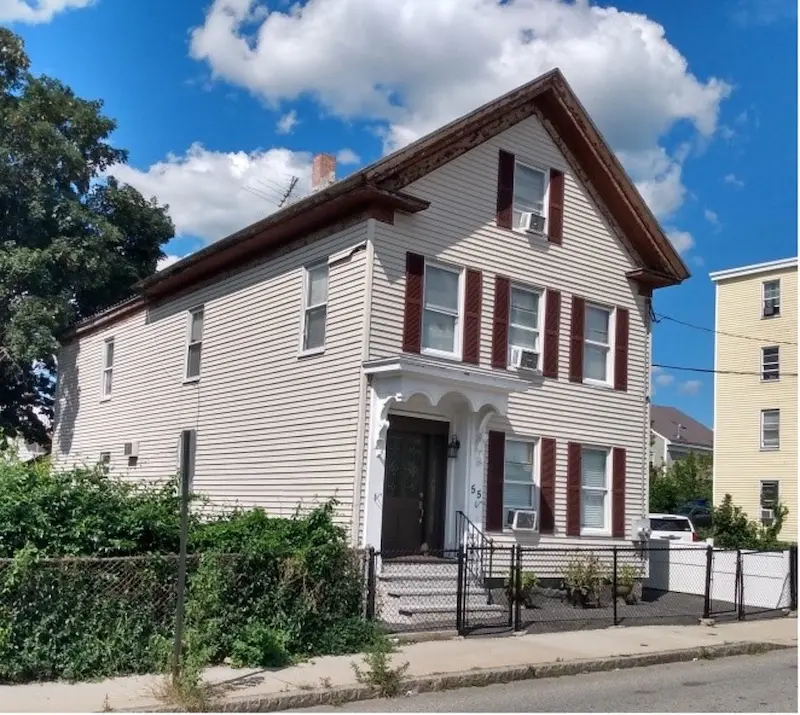 Exterior of single family Greek Revival home. 