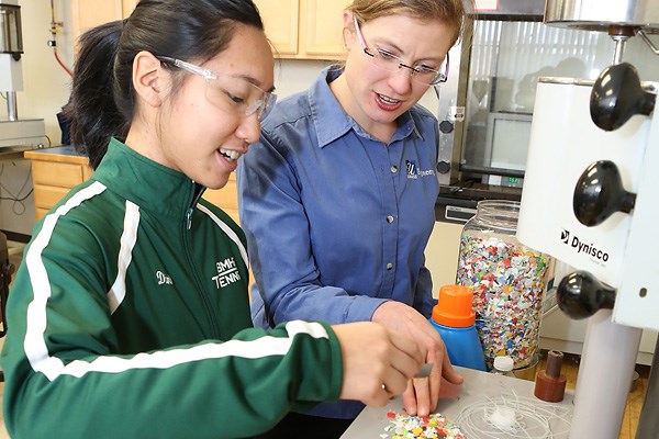 Assoc. Prof. Meg Sobkowicz-Kline and student Jennifer Dinh characterize mixed plastic flakes for recycling