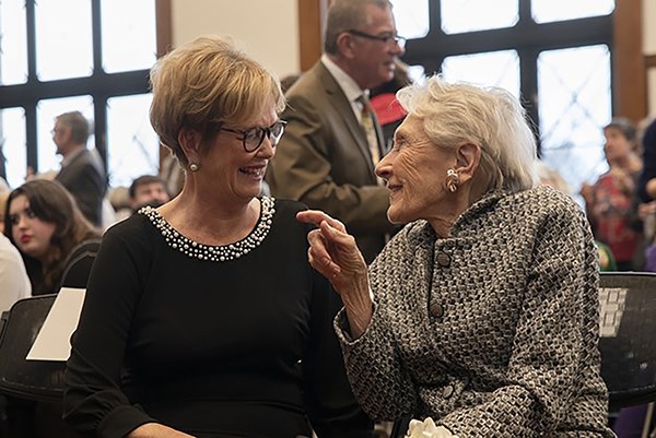 UMass Lowell Chancellor Jacquie Moloney talks with Lowell philanthropist Nancy Donahue during the 2022 Nancy L. Donahue Celebration of the Arts 