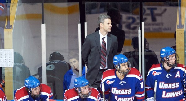 Men's ice hockey Head Coach Norm Bazin behind the bench
