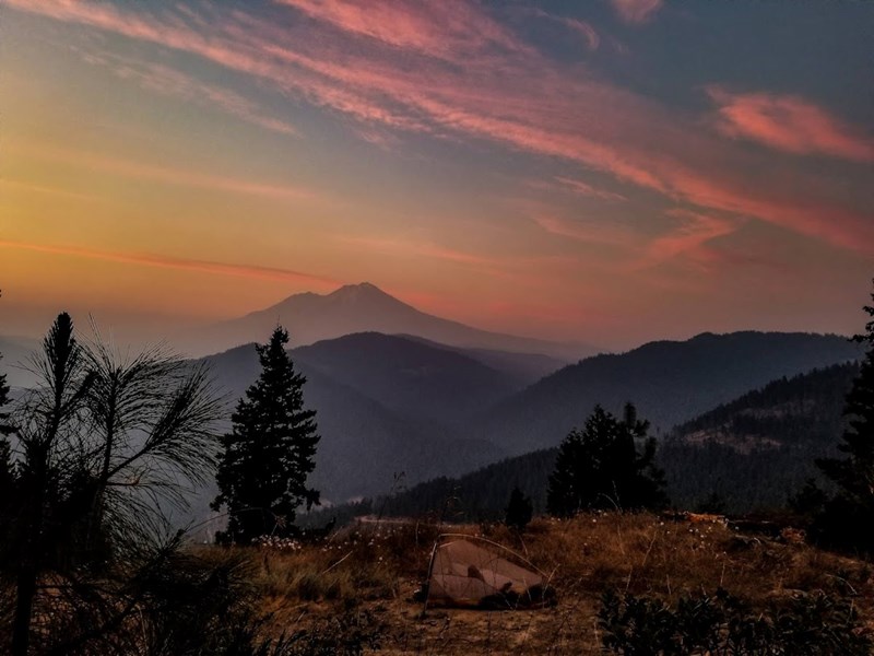 Kyle Soeltz's tent pitched in the mountains at sunset on the Pacific Crest Trail