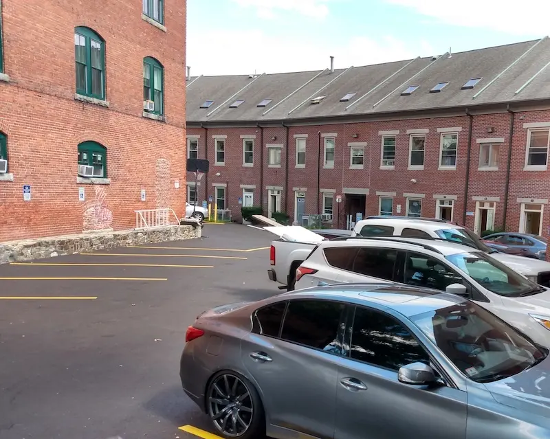 Former site of 9-15 Bent's Court, now a parking lot between two buildings.