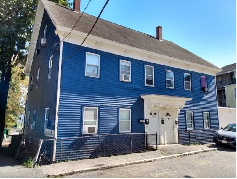 Exterior of two-family, two-story home in Italianate styel.