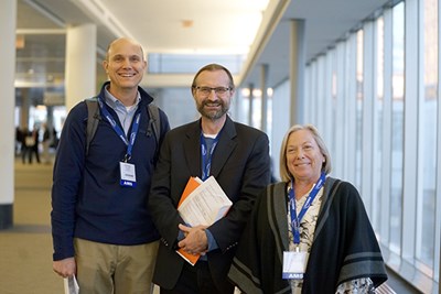 Mathias Collins, Mathew Barlow and Laurie Agel pose for a photo at the conference