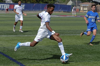Abdi Shariff-Hassan dribbles the ball during a game