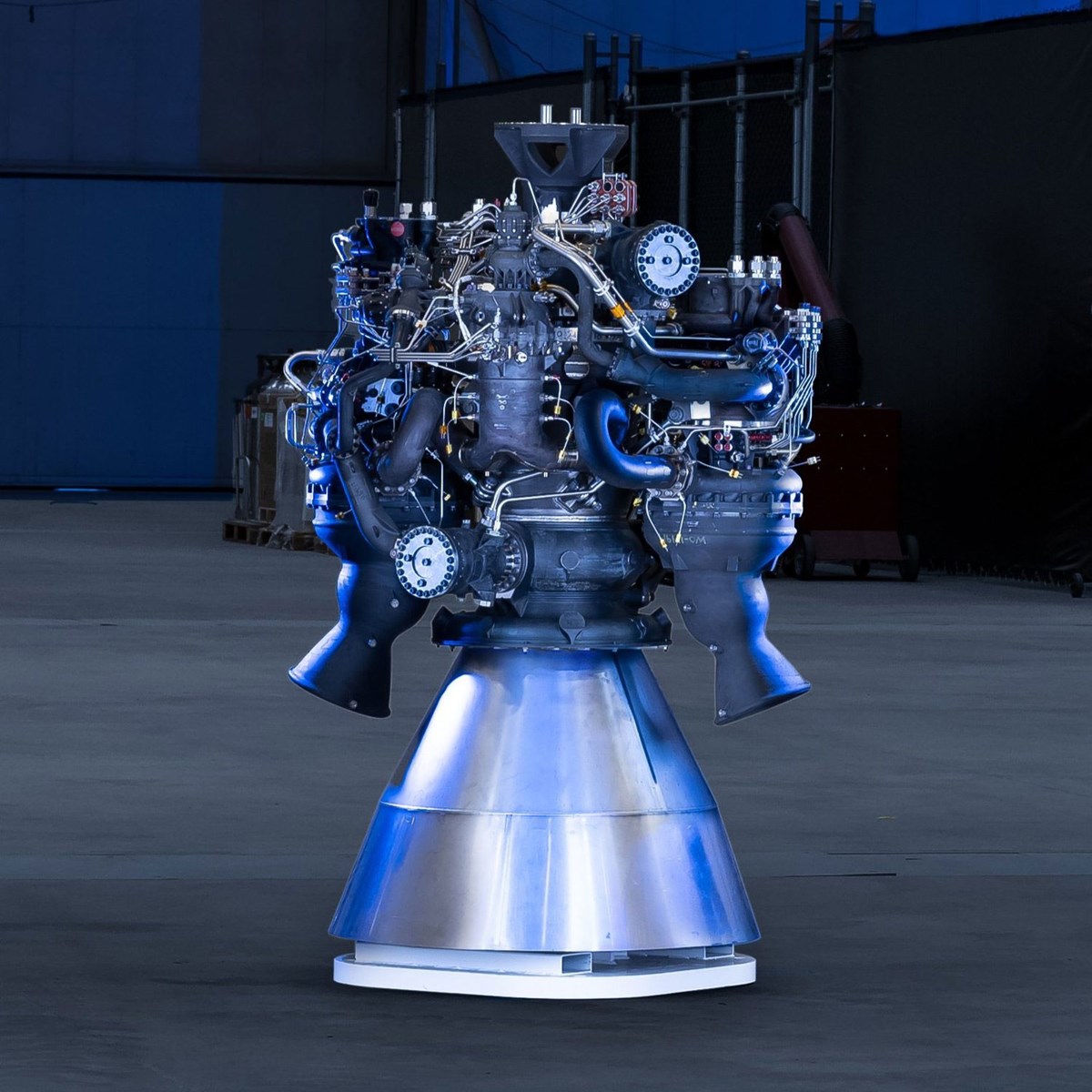 Metal 3-D printed rocket engine placed on the ground. 