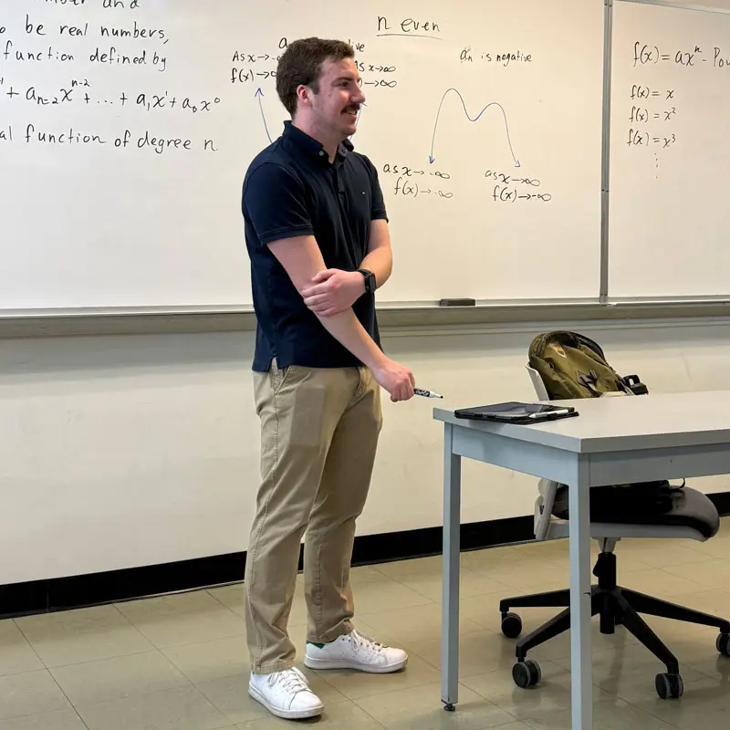 Andrew Fontecchio stands in a math classroom at UMass Lowell.
