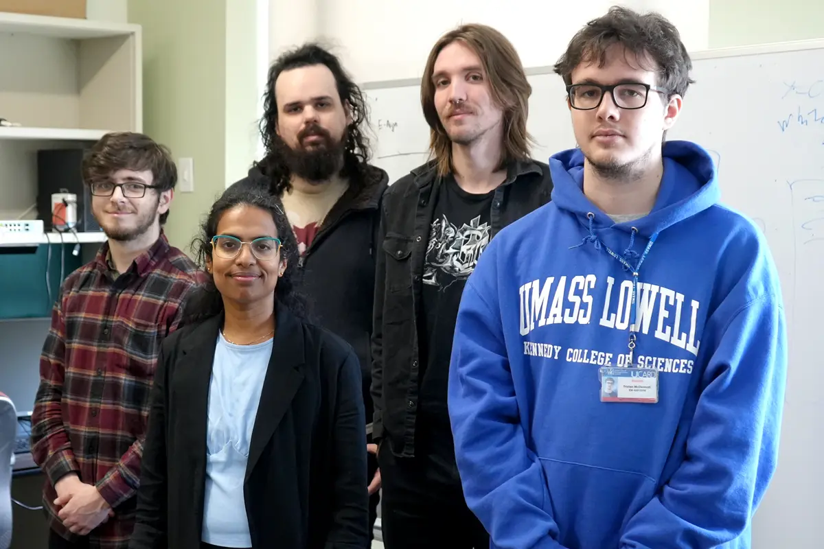 Anitha Gollamudi poses with her four lab group members.