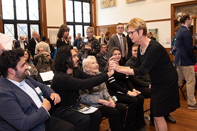Chancellor Jacquie Moloney holds the hand of theatre arts student Lucas Bermudez, as philanthropist Nancy L. Donahue and theatre arts students Raphaela Pereira and Cristian Ramos Delgado look on