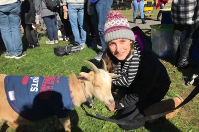 Nursing major Ashlyn Newell pets a goat