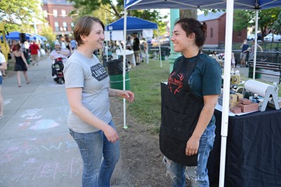Gabby Davis talks to a vendor at a Made in Lowell event in Lucy Larcom Park.
