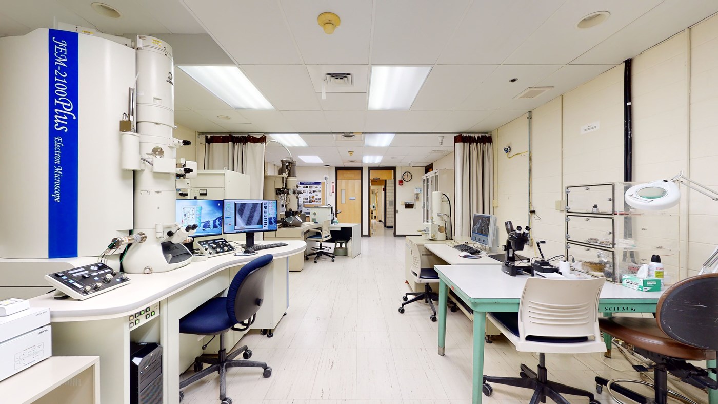 Desks with computers and equipment in UMass Lowell's Microscopy Core Lab