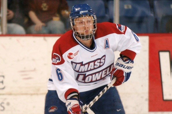 Barry Goers playing for the UML hockey team