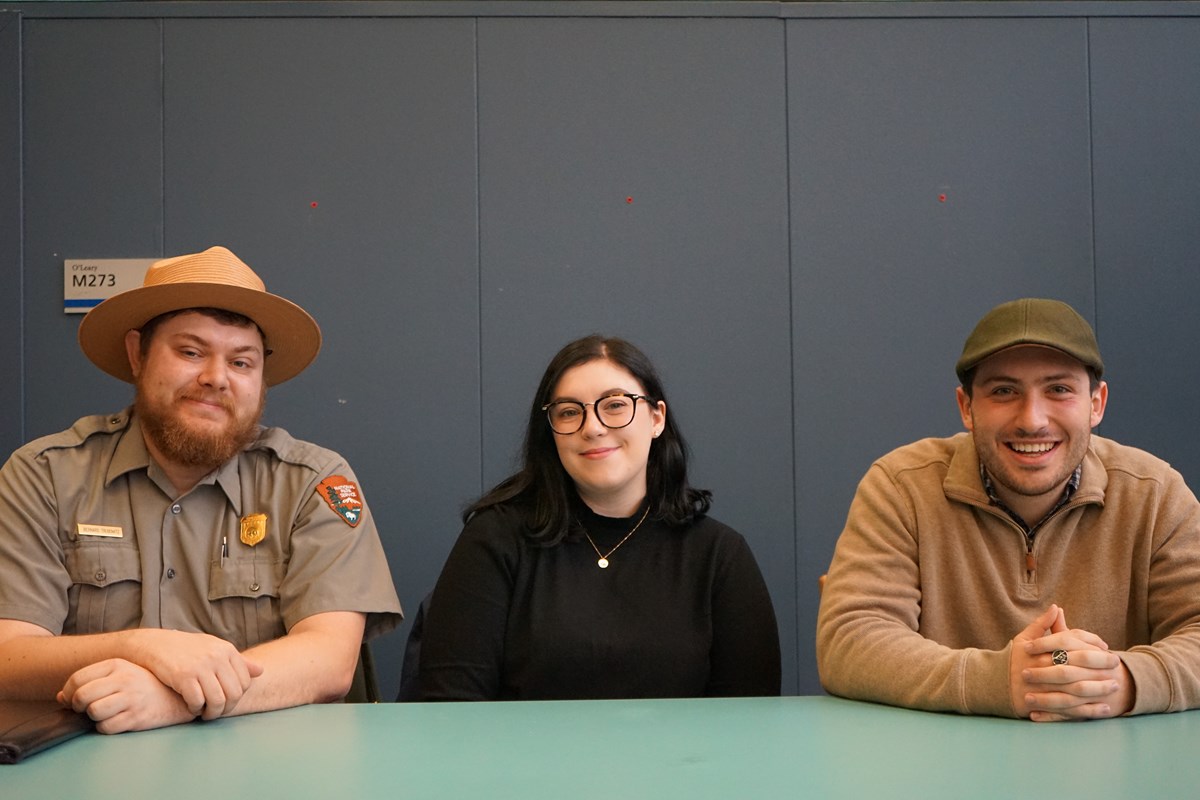 Bernard Trubowitz in a park ranger uniform sitting with two other people