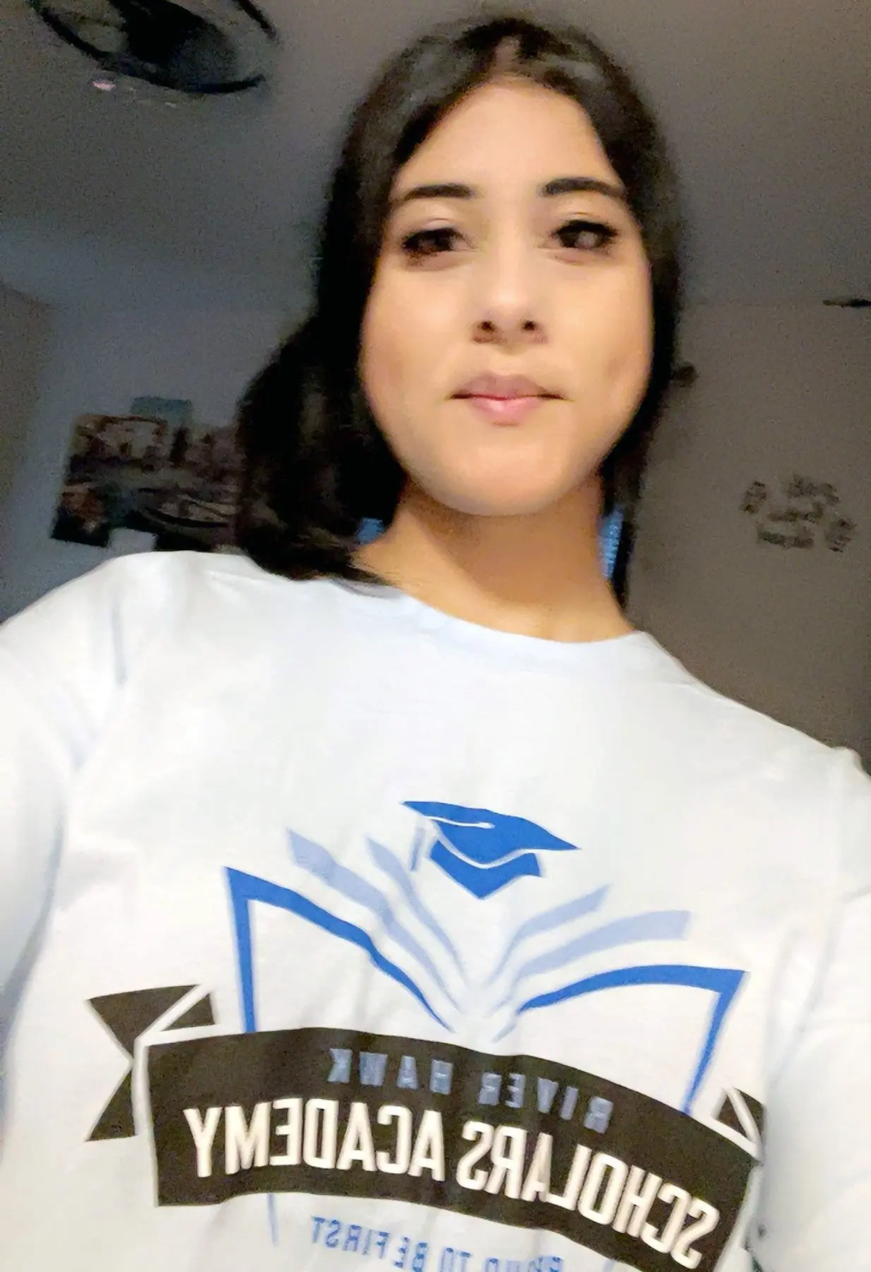Aanya Bharti wearing a River Hawks Scholars Academy shirt.