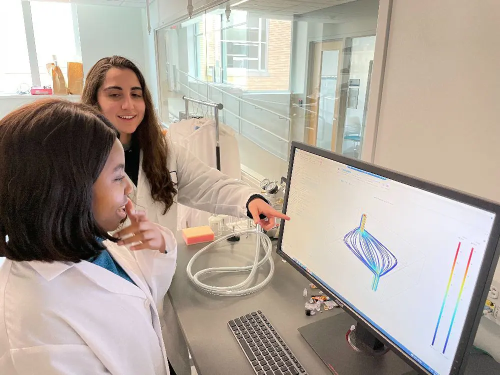Biomedical Researchers looking at a computer monitor