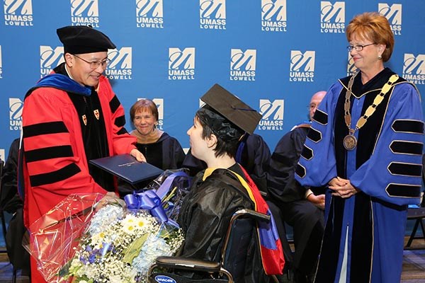 Brianna Gainley receives her degree from Jie Wang