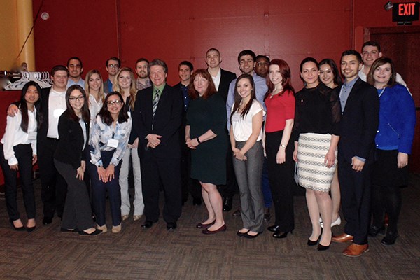 Manning students pose with alumni in Omaha, Neb.