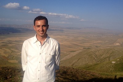FAHSS grad Burhan Colak poses overlooking Doğubayazit