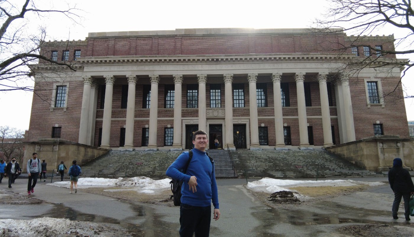 Man standing in front of museum