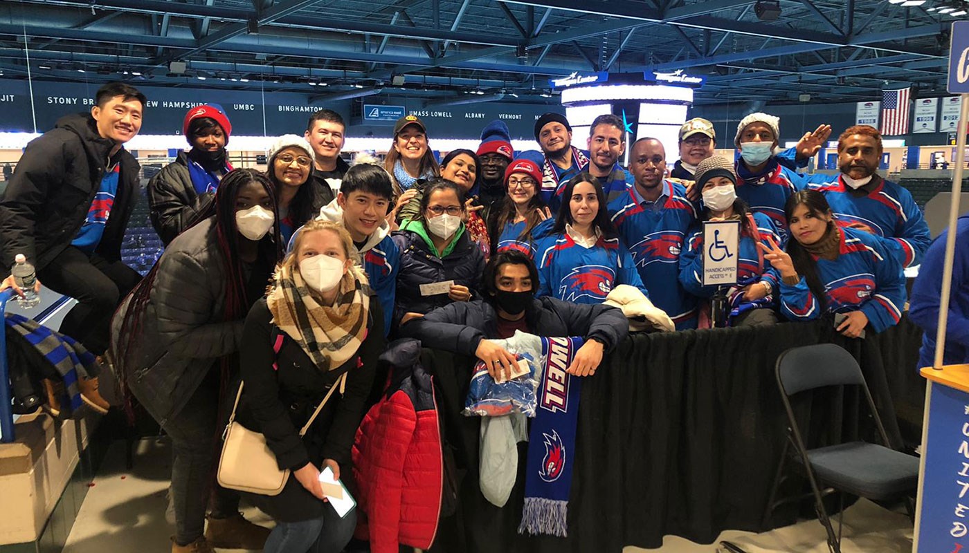 Consortium members gather at a hockey game