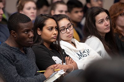 Criminal justice students listen intently during a panel on the case of Kalief Browder at UMass Lowell