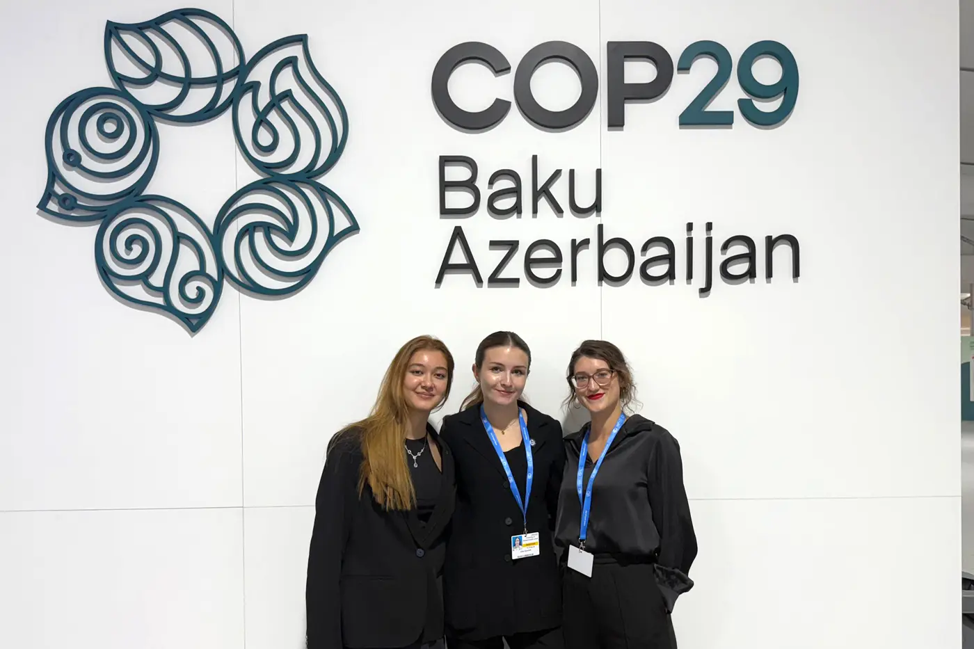 Three students at COP29 in Baku, Azerbaijan.