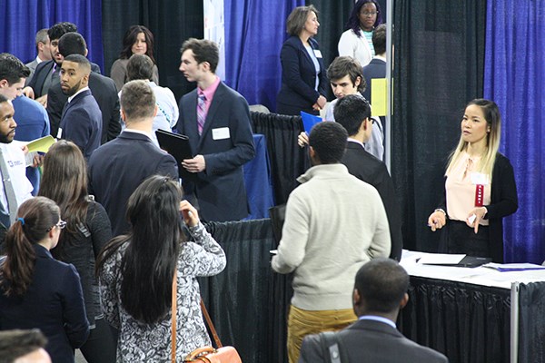 Tiffany Soun speaks with students at the Spring Career Fair