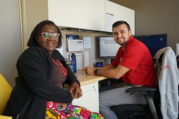 Asst. Director of Career Services Serwa Addae-Adoo sits with Career Peer Shaymus Dunn