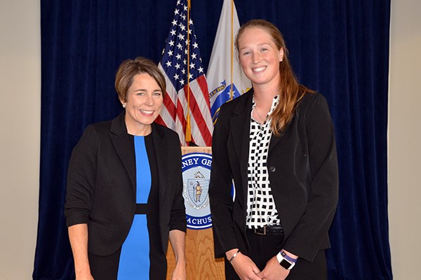 Massachusetts Attorney General Maura Healey poses for a photo with Courtney Cashman
