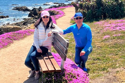 Xiaoqing (Cathy) Wang ’92 (left) and Jian (Jim) Lou ’92, shown here in Pacific Grove, California, established two scholarships in memory of Computer Science Prof. Georges Grinstein, who extended many kindnesses to the couple when they were graduate students.