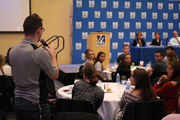 A student asks a question during the Chancellor's Forum