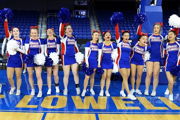 The UML cheerleaders root on the women's basketball team at the Tsongas Center