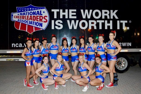 The cheerleading team poses for a picture at the NCA competition
