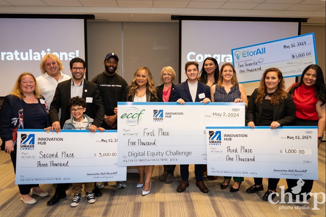 The winners of the Digital Equity Challenge celebrate with event judges and organizers. 