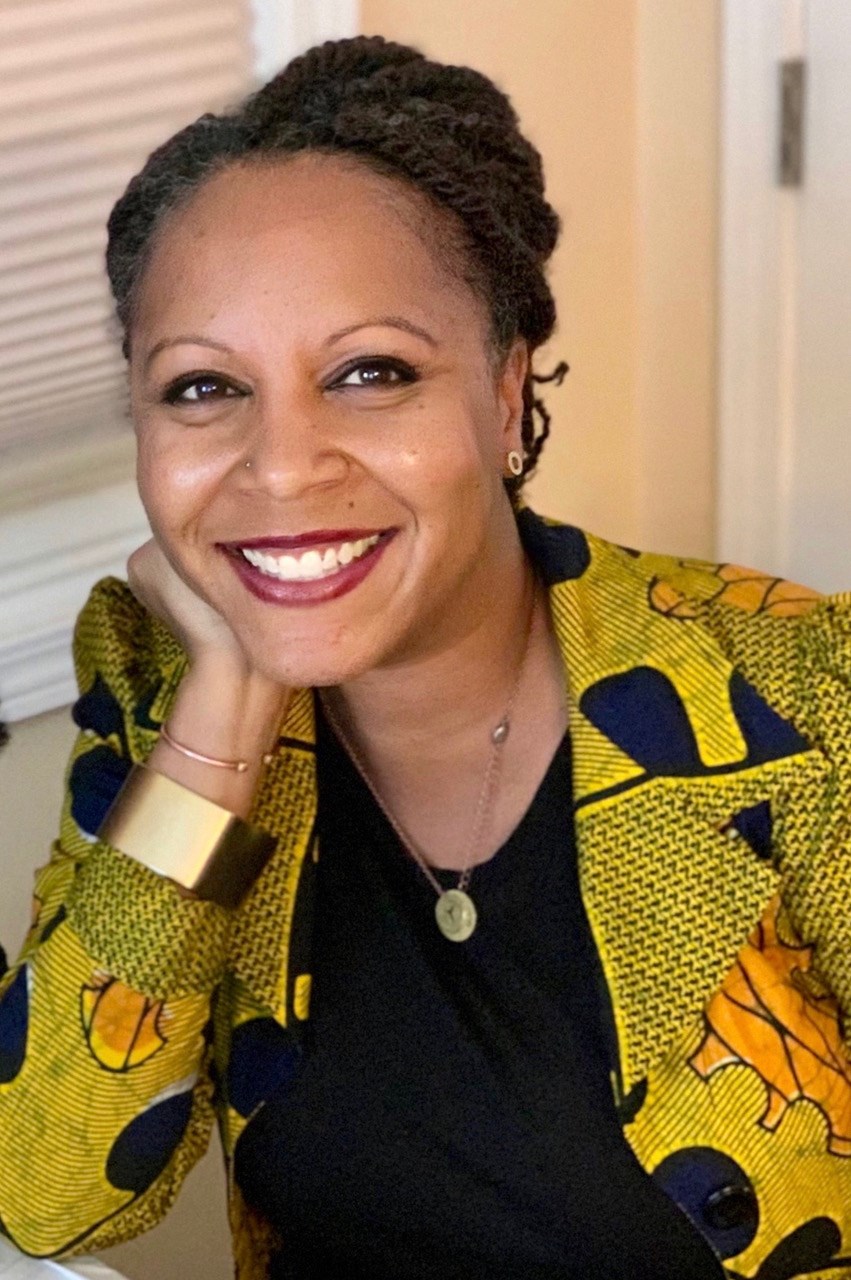 photo of panelist Christina M. Greer in her office at Fordham University. Christina M. Greer, PhD, is an Associate Professor of Political Science and American Studies at Fordham University (Lincoln Center Campus). She was the 2018 Fellow for the McSilver Institute for Poverty Policy and Research at New York University Silver School of Social Work.